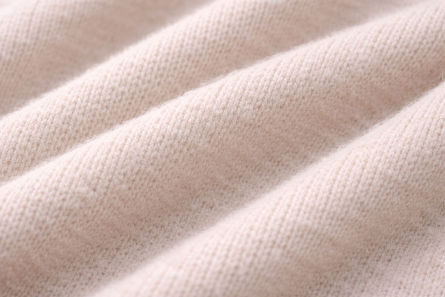A close-up of a soft organic cotton knit fabric