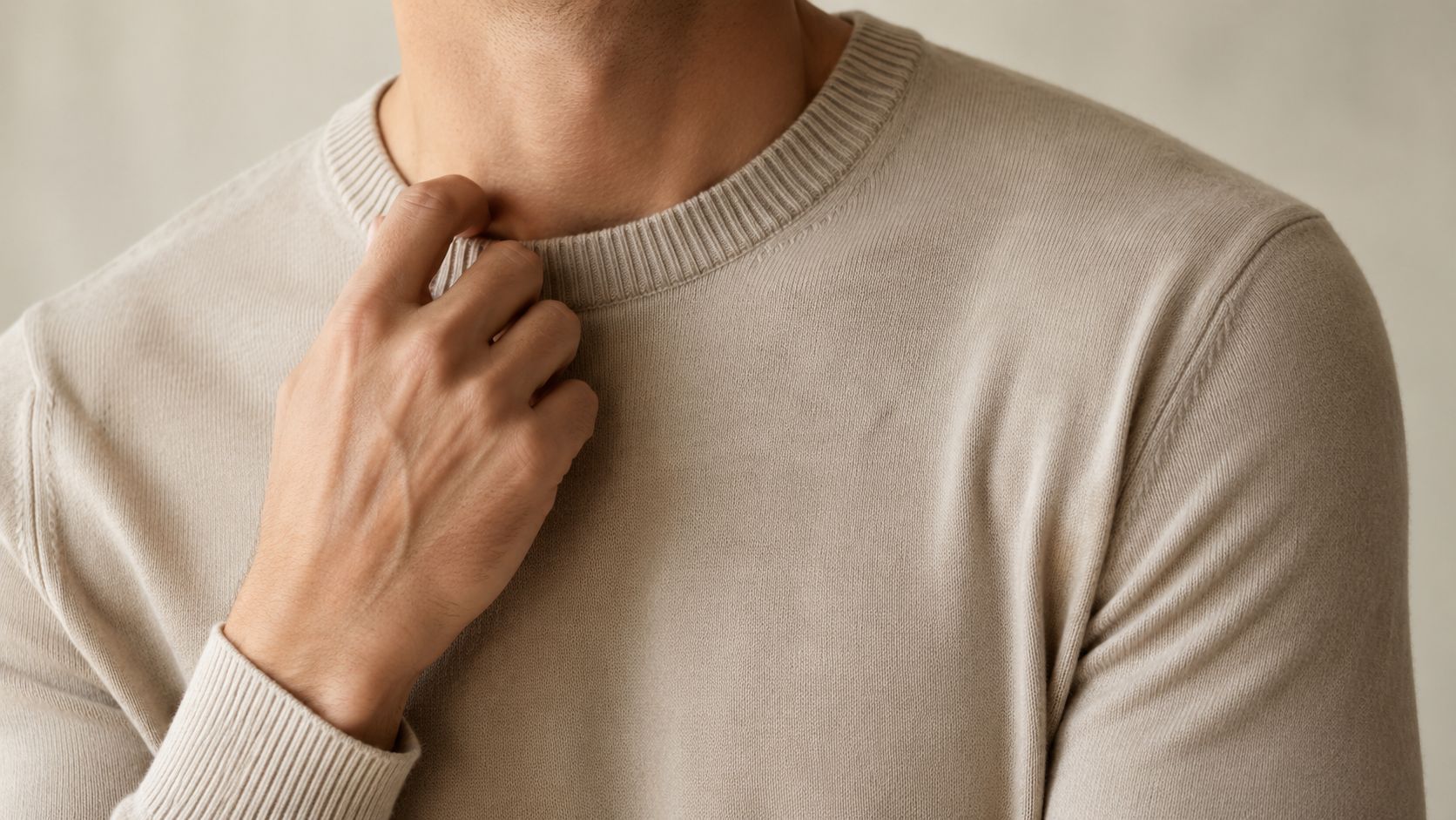 A person wearing a fine merino wool sweater comfortably against bare skin